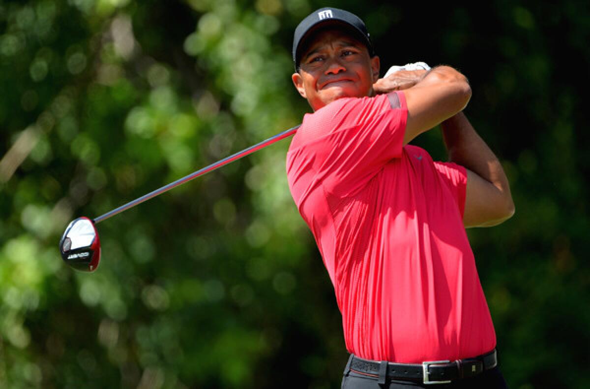 Tiger Woods watches his drive at No. 3 during the final round of the Honda Classic on Sunday.