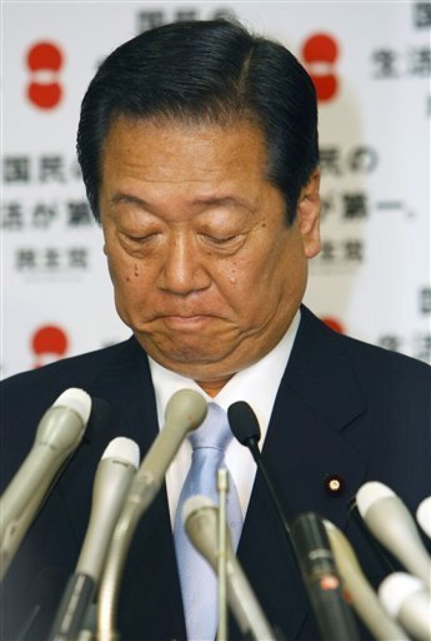 Ichiro Ozawa, head of the largest opposition Democratic Party of Japan, bites his lips during a press conference in Tokyo, Japan, Monday, May 11, 2009. Ozawa said he will resign to keep a political funding scandal from pulling down his party in upcoming parliamentary elections. (AP Photo/Shizuo Kambayashi)