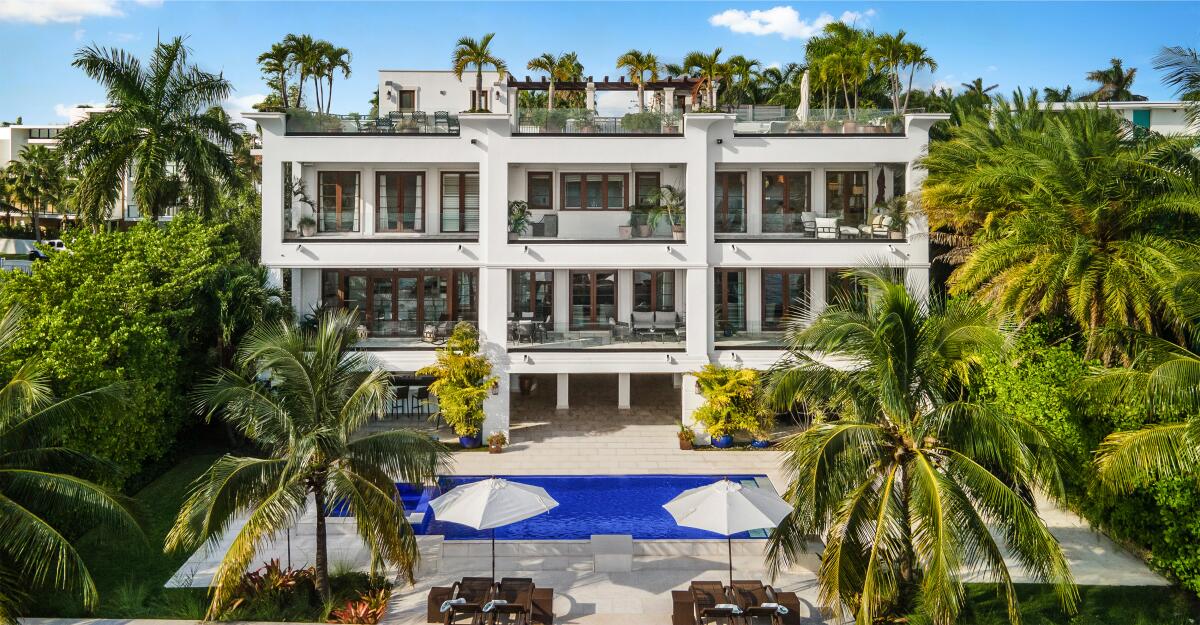 The three-story home on Palm Island is topped by a 5,000-square-foot rooftop deck overlooking Biscayne Bay.
