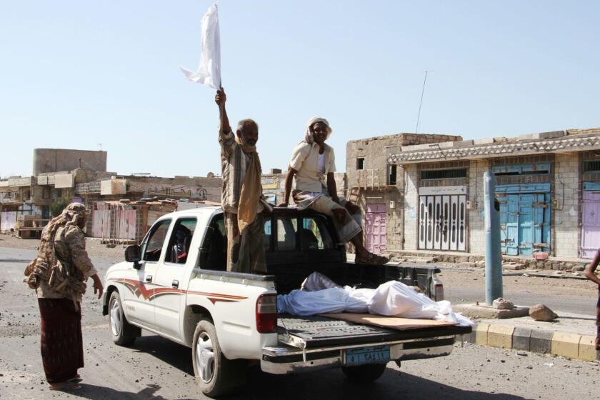 (FILES) In this file photo taken on February 11, 2017 a Yemeni man standing on a pick-up truck loaded with a body waves a white flag towards fighters loyal to the Saudi-backed Yemeni president in the western coastal town of Mokha as pro-government forces advance in a bid to try to drive the Shiite Huthi rebels away from the Red Sea coast. - Four years after Saudi Arabia led a military intervention in Yemen to back the government against rebels, the only hope for peace in a country threatened by famine hangs on a fragile truce. (Photo by SALEH AL-OBEIDI / AFP)SALEH AL-OBEIDI/AFP/Getty Images ** OUTS - ELSENT, FPG, CM - OUTS * NM, PH, VA if sourced by CT, LA or MoD **