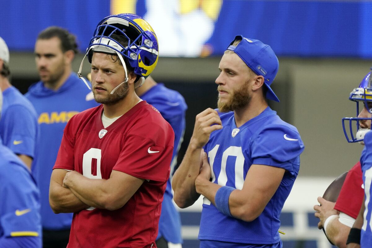  Rams' Matthew Stafford, left, stands next to wide receiver Cooper Kupp during training camp.