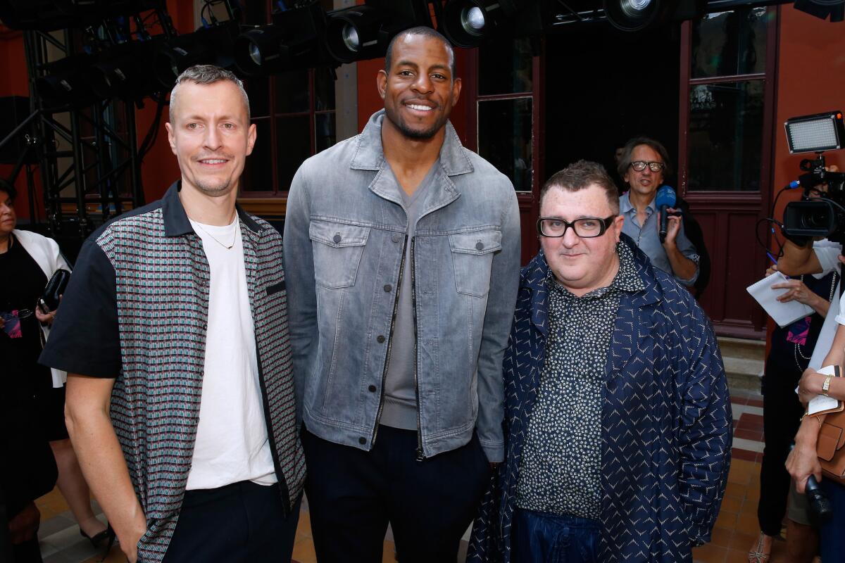 From left, Lanvin menswear designer Lucas Ossendrijver, Golden State Warrior and NBA Finals MVP Andre Iguodala and Lanvin creative director Alber Elbaz at Lanvin’s spring and summer 2016 menswear runway show in Paris on Sunday.