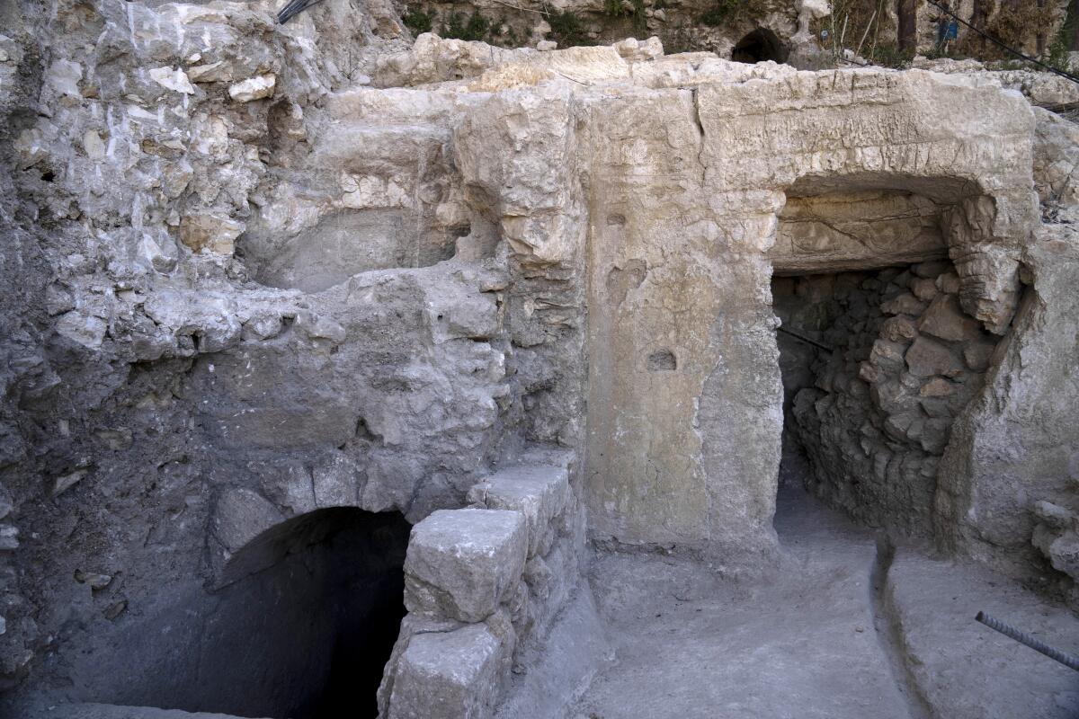 The site of a Jewish ritual bath or mikveh, left, discovered near the Western Wall in the Old City of Jerusalem, Sunday, July 17, 2022. An excavation to build an accessible elevator from the Jewish Quarter to the Western Wall near the Temple Mount by the Hebrew University of Jerusalem's Institute of Archaeology has unearthed the mikveh that dates back to the 1st Century CE. (AP Photo/Maya Alleruzzo)