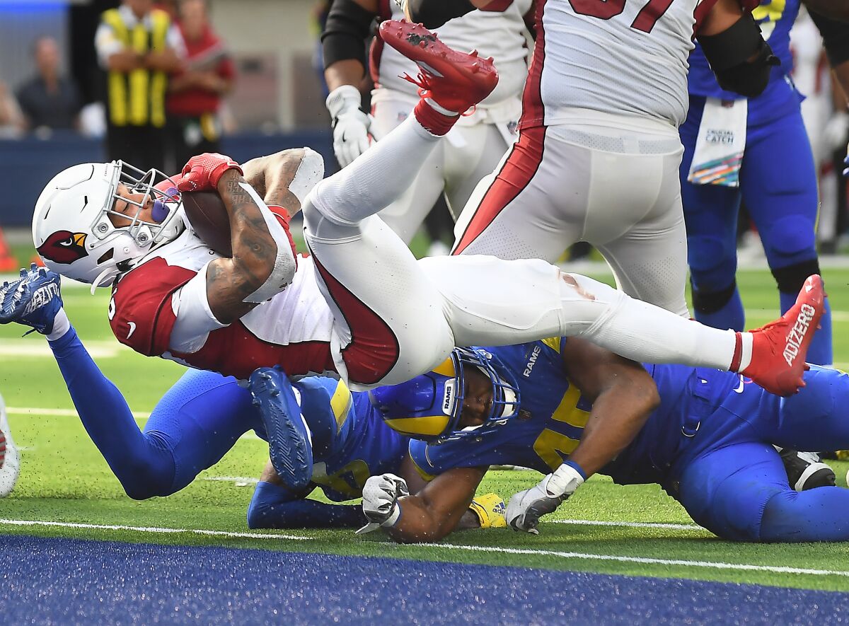 Cardinals running back James Conner scores a touchdown against the Rams in the third quarter.