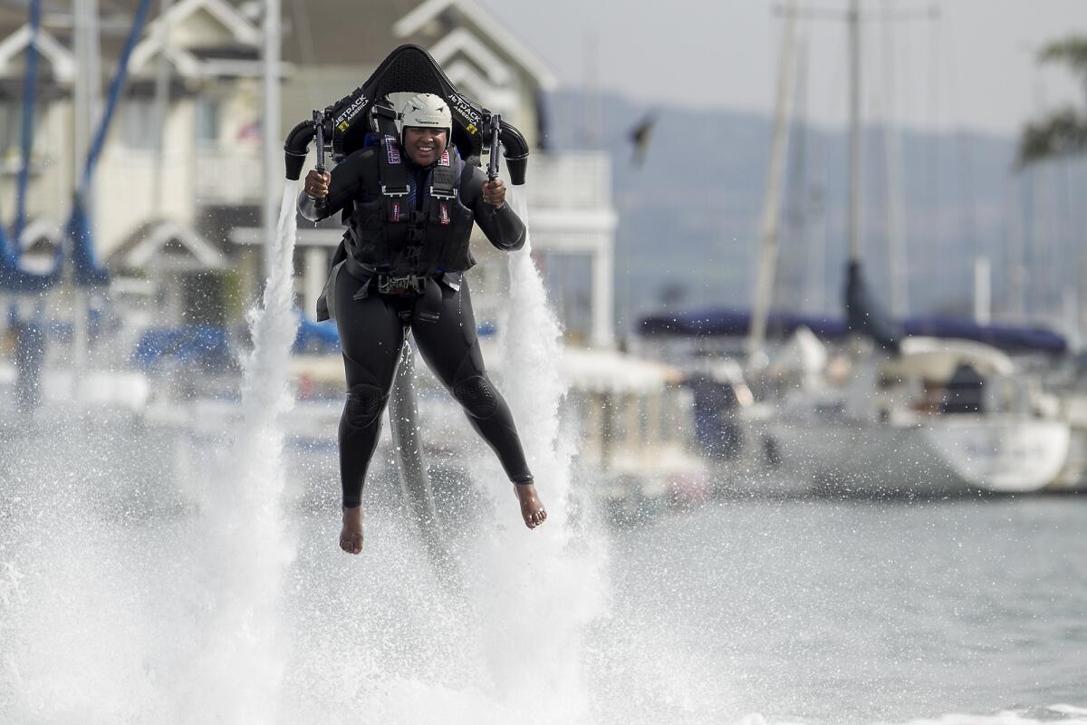 Gracie Henley, 26, from Houston, gets some air on a Water Jet Pack with the company Jetpack America in Newport Beach on Feb. 20.