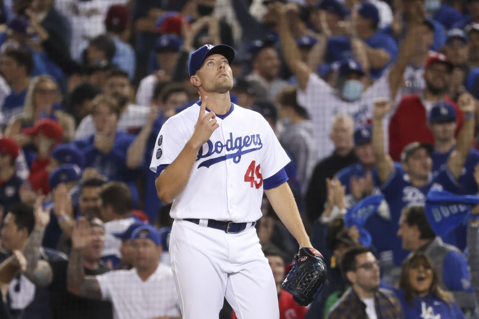 Dodgers reliever Blake Treinen points to the sky after retiring the side in the 2021 postseason.