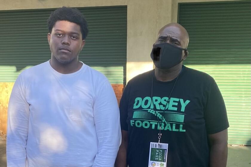 Elijah Henderson (left), a 6-6, 356-pound sophomore at Dorsey.