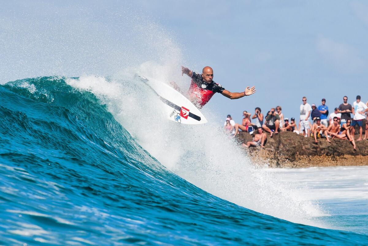 Kelly Slater, competing in a March pro surfing event, has pulled out of the U.S. Open in Huntington Beach.