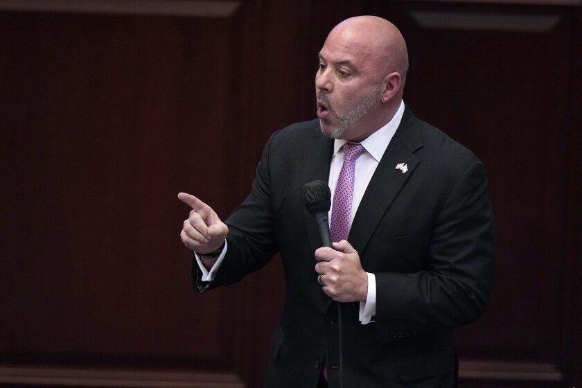 Florida lawmaker Blaise Ingoglia speaks into a microphone.