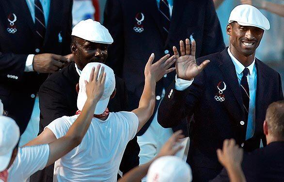 Kobe Bryant smiles at the crowd during the opening ceremony to kick off the 2008 Beijing Olympics.