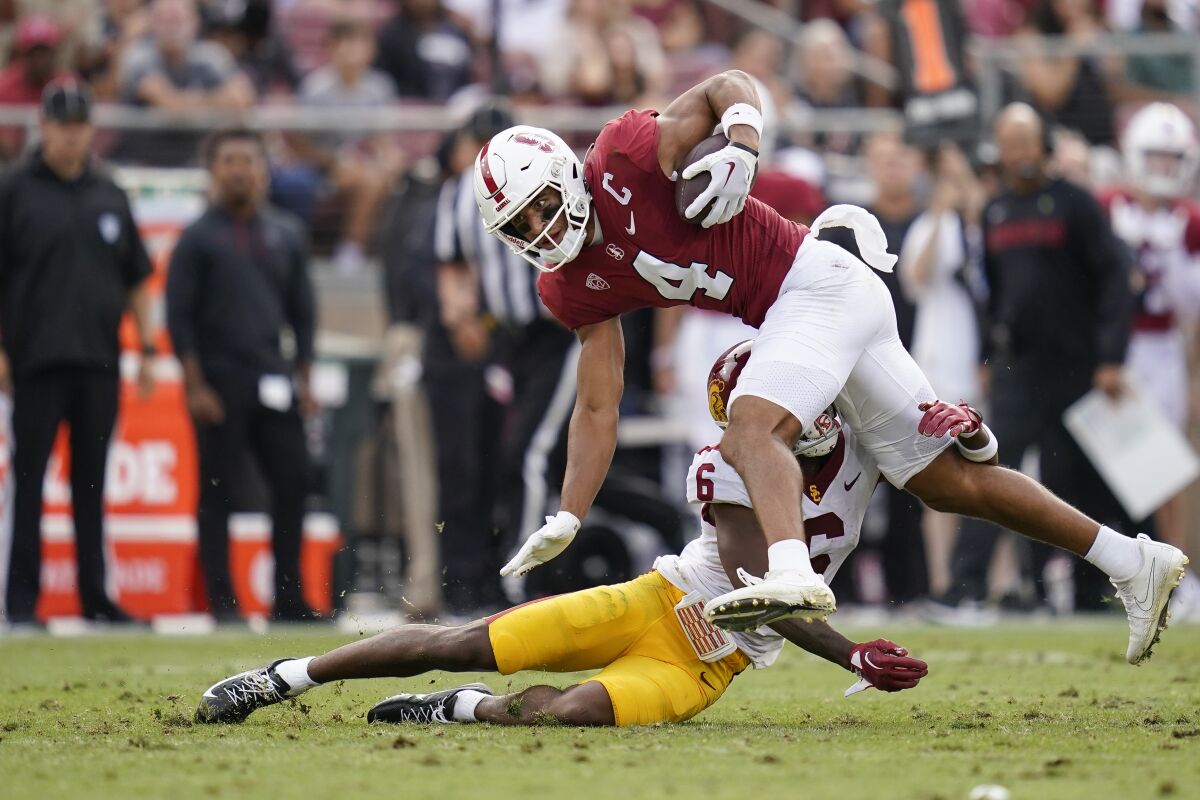 USC defenseman Mekhi Blackmon tackles Stanford wide receiver Michael Wilson.