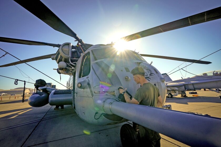 San Diego, CA - September 22: At MCAS Miramar on Thursday, Sept. 22, 2022 in San Diego, CA., Cpl. Caden Peters was among the Marines preping this CH-53 Sea Stallion that will be part of the static line display of aircraft on display for the public during the annual MCAS Miramar Airshow. (Nelvin C. Cepeda / The San Diego Union-Tribune)