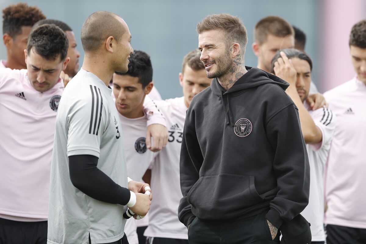 David Beckham, the owner and president of soccer operations for Inter Miami CF, speaks with the team's goalkeeper, Luis Robles,  during a team media session on Feb. 25.