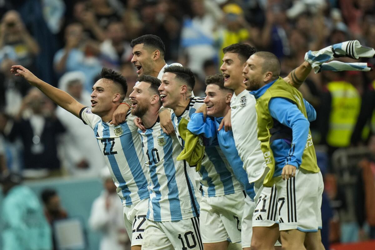 Players for Argentina, including Lionel Messi (10), celebrate after defeating the Netherlands on penalty kicks Dec. 10, 2022.