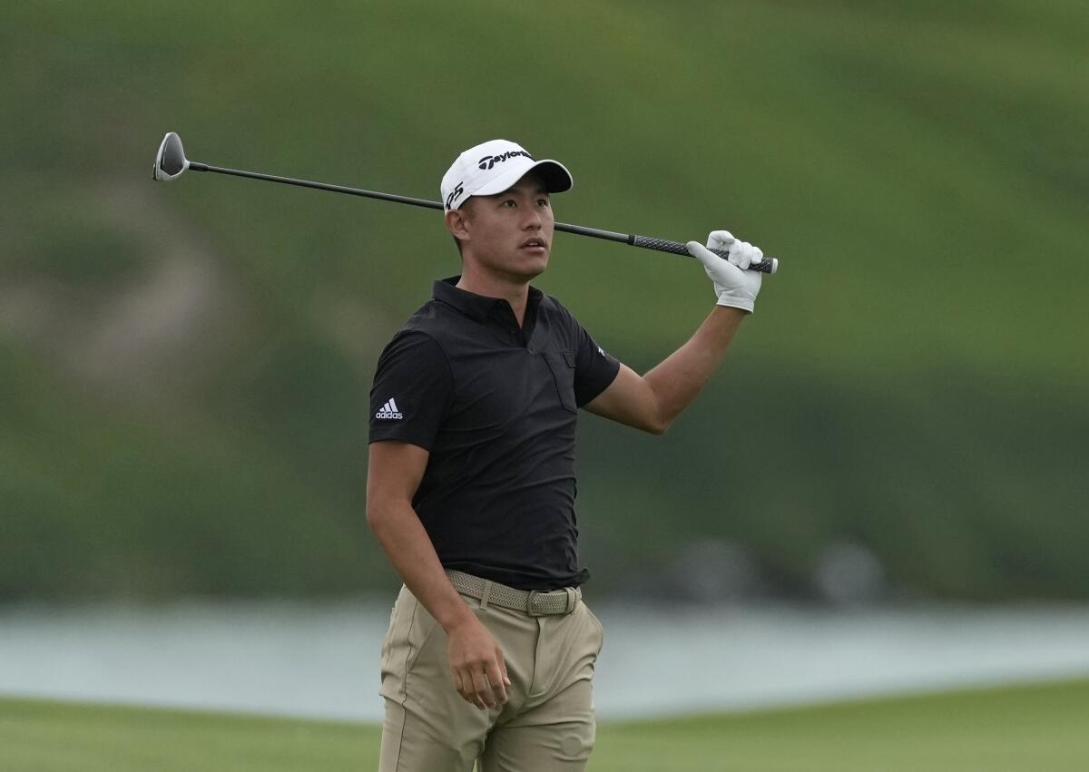 Collin Morikawa from the U.S. follows his ball on the 18th hole during the first round of the Abu Dhabi Championship golf tournament at the Yas Links Golf Course, in Abu Dhabi, United Arab Emirates, Thursday, Jan. 20, 2022. (AP Photo/Kamran Jebreili)