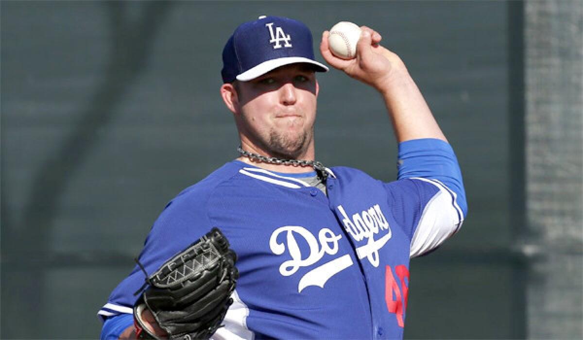 Paul Maholm, seen last month, gave up six runs to the Cincinnati Reds on six hits with two home runs over 2 2/3 innings for the Dodgers on Thursday. The Dodgers lost, 8-2.