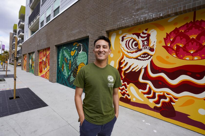 San Diego, CA - February 29: Josue Baltezar is a local Mexican-American artist who was the lead muralist for the six-panel murals on the Plaza del Sol apartment complex in City Heights. The six panels were designed to represent the ethnicity in City Heights. Somalia, Ethiopian, Kumeyaay, Latino and Vietnamese, and the sixth panel is a representation of San Diego’s regional diversity. (Nelvin C. Cepeda / The San Diego Union-Tribune)