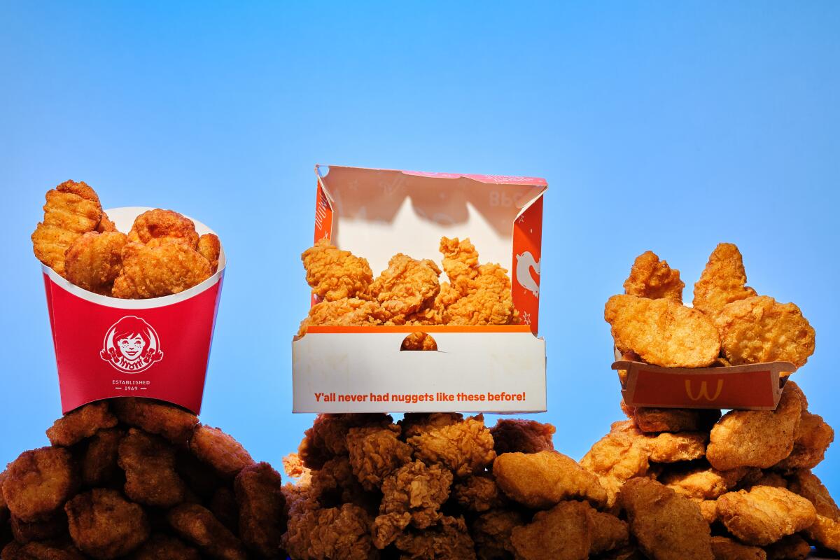 Chicken nuggets in boxes from Wendy's, Popeyes and McDonald's.