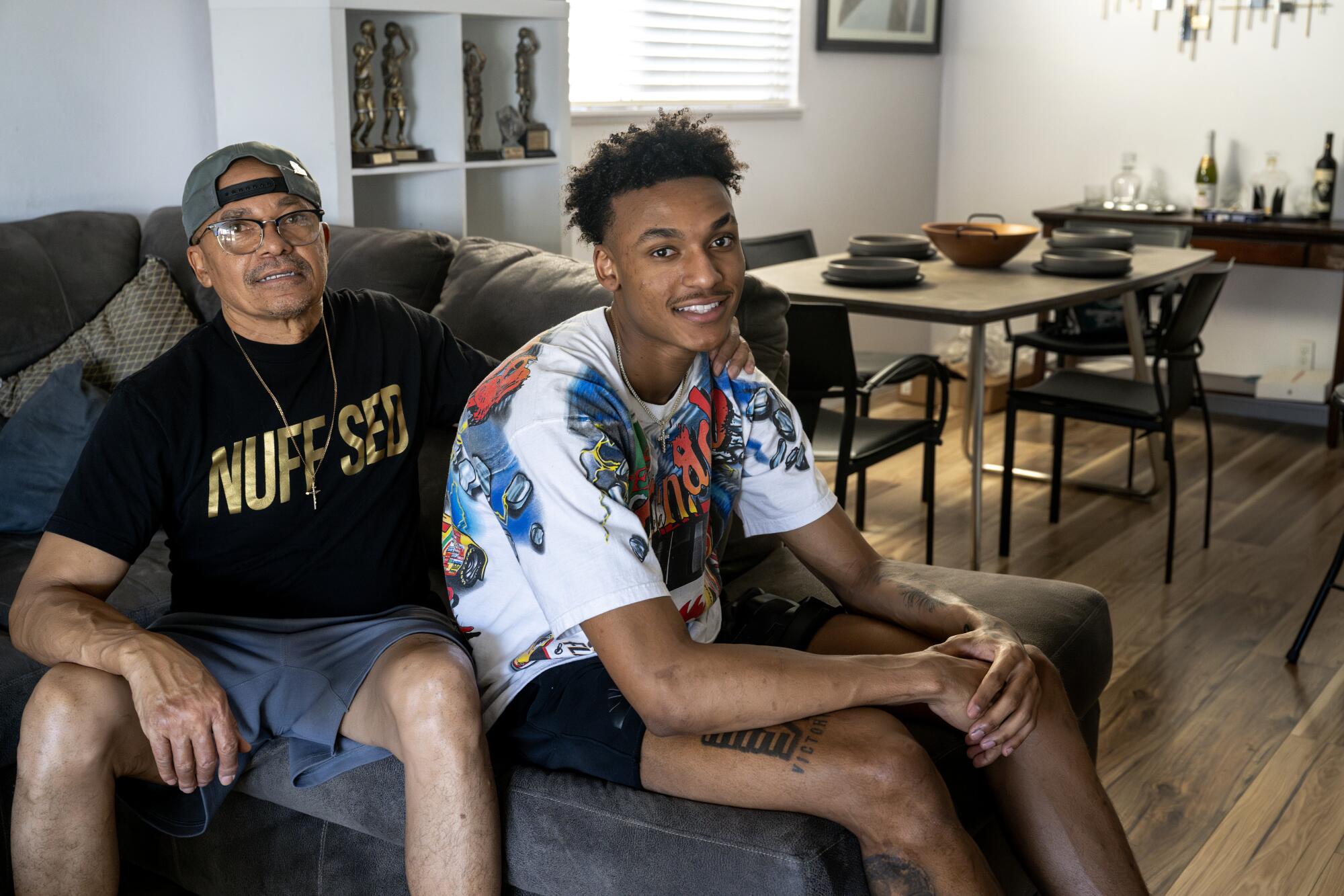Lakers rookie Maxwell Lewis, right, spends time with his dad, Robert Lewis, at home in Las Vegas.