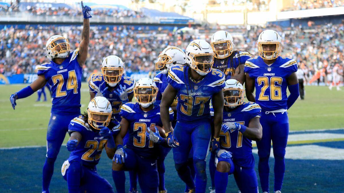 A fourth-quarter fumble recovery against the Cleveland Browns leads to a Chargers celebration at StubHub Center on Sunday.