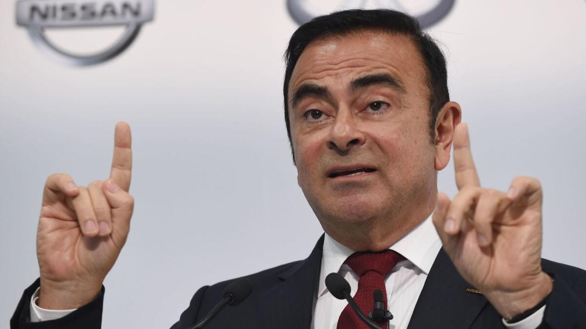 The Nissan Motor Co. board of directors voted unanimously to dismiss Carlos Ghosn, seen at a news conference in 2015, as chairman on Thursday.