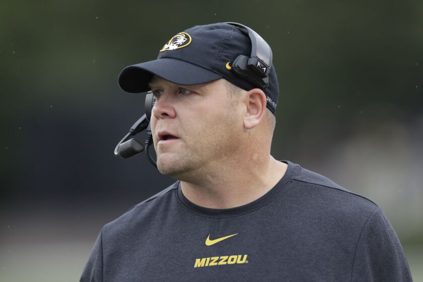 FILE - Missouri head coach Barry Odom watches in the first half of an NCAA college football game against Vanderbilt on Oct. 19, 2019, in Nashville, Tenn. Odom, former Missouri football coach, was hired by UNLV on Tuesday, Dec. 6, 2022, for the same position. (AP Photo/Mark Humphrey, File)