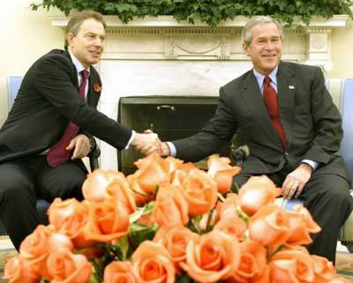 President Bush welcomes British Prime Minister Tony Blair to the White House Oval Office for a formal meeting on Nov. 12, 2004.