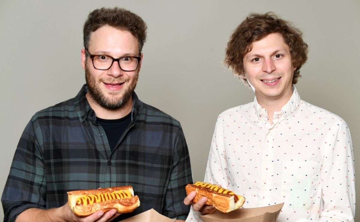 Seth Rogen and Michael Cera, who take hot dog humor to uncharted movie territory in "Sausage Party."