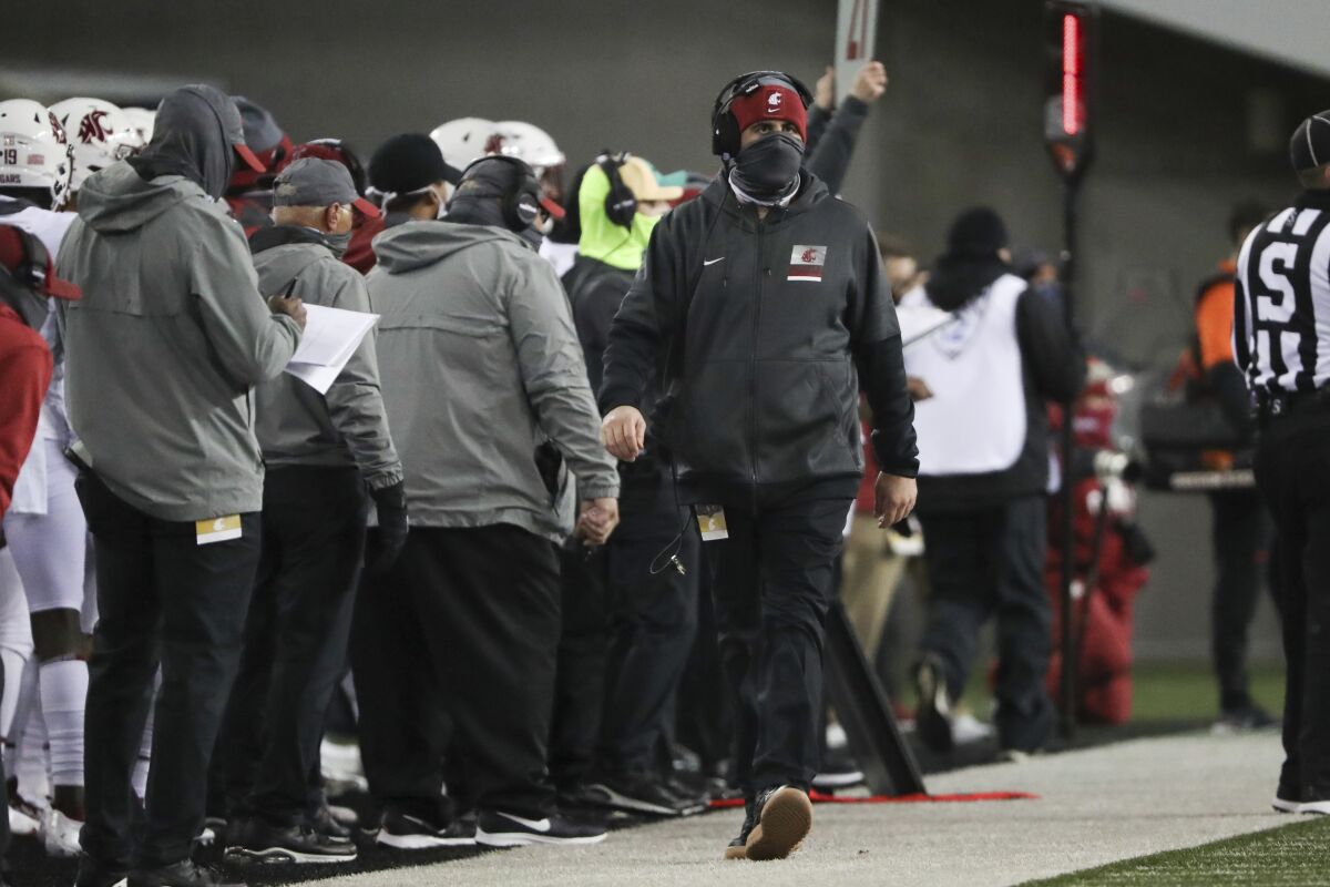 Washington State coach Nick Rolovich along the sideline during the first half of the team's NCAA college football game against Oregon State in Corvallis, Ore., Saturday, Nov. 7, 2020. (AP Photo/Amanda Loman)