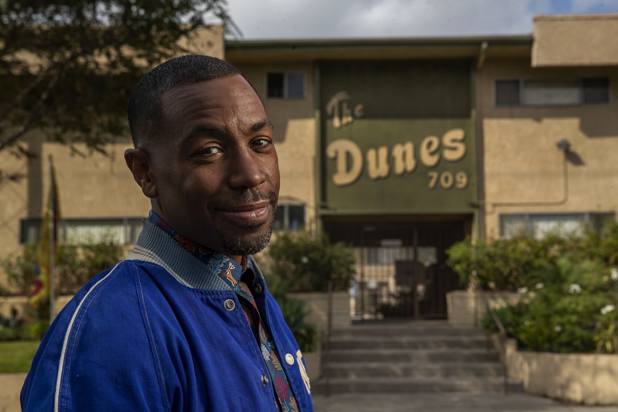 "Insecure" showrunner Prentice Penny stands in front of the Dunes apartment complex in Inglewood.
