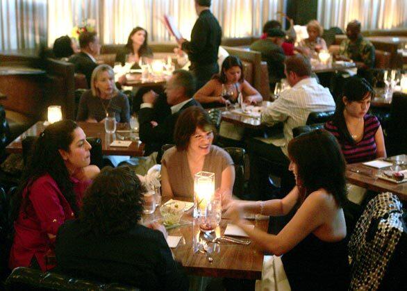 Customers dine by the warm glow of candles at Beso, the Hollywood restaurant that "Desperate Housewives" star Eva Longoria Parker opened in March. She brought in Boston-based Todd English as the chef.