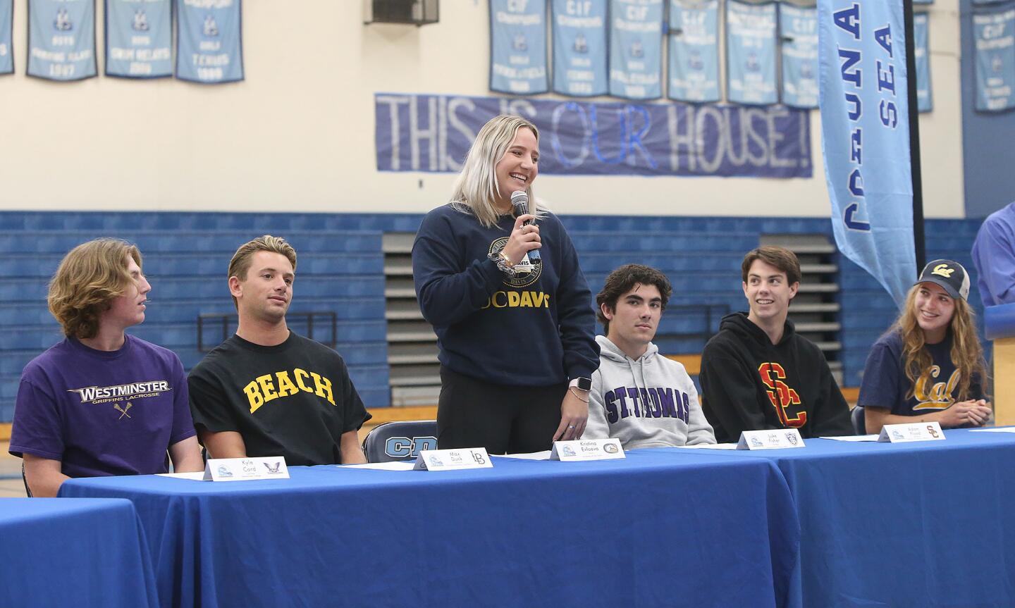 Kristina Evloeva tells the audience she's attending UC Davis to play women's tennis during the Corona del Mar commitment ceremony in the main gym on Wednesday.