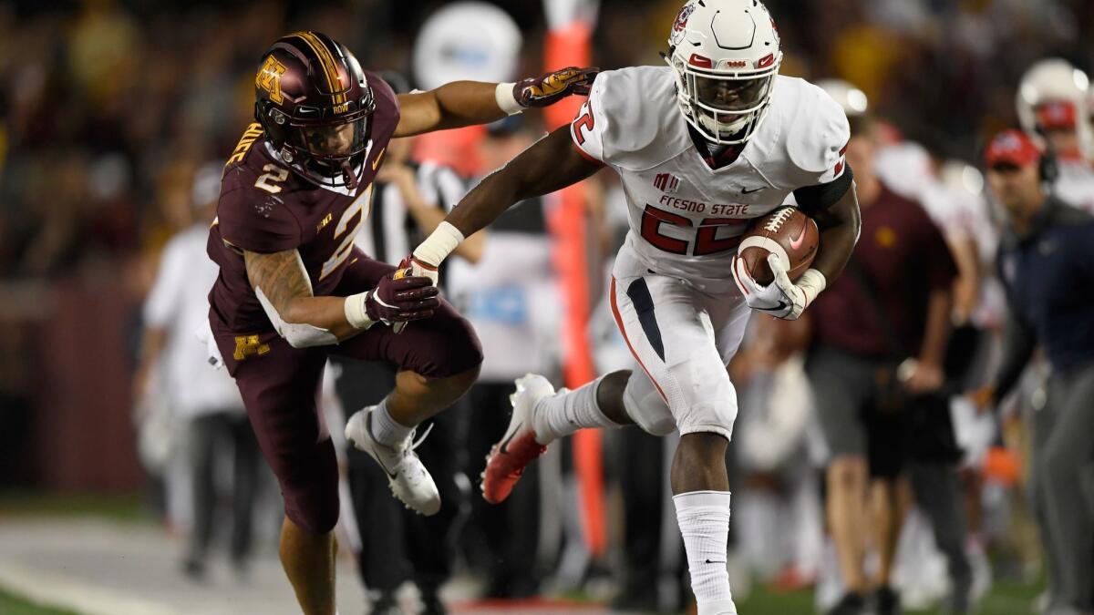 Fresno State's Jordan Mims, foreground, is pushed out of bounds by Minnesota's Jacob Huff during the fourth quarter on Sept. 8, 2018 at TCF Bank Stadium in Minneapolis.