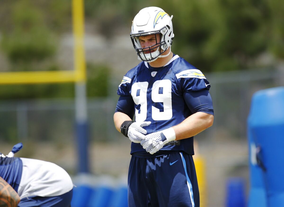 San Diego Chargers Joey Bosa looks on during practice.