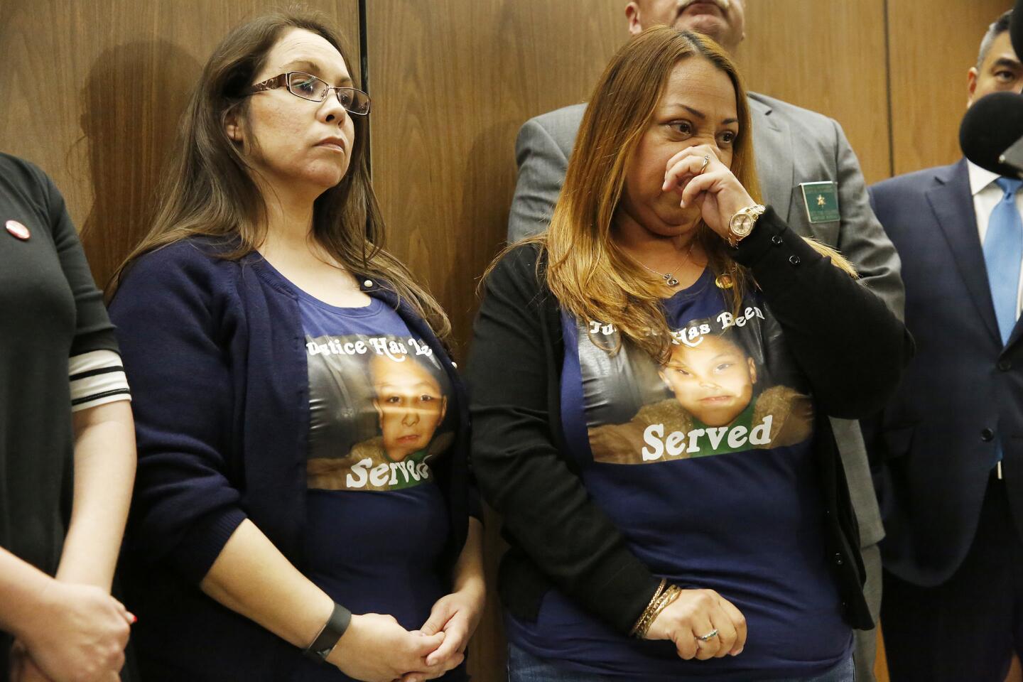 Gabriel Fernandez's cousin Emily Carranza, left, and Olivia Rubio wear shirts printed with "Justice Has Been Served" as they talk to media after Gabriel's mother and her boyfriend were sentenced for the boy's killing.