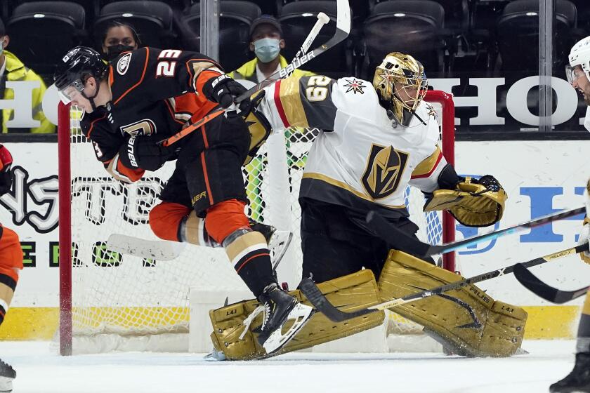 Anaheim Ducks' Sam Steel (23) collides with Vegas Golden Knights goaltender Marc-Andre Fleury.