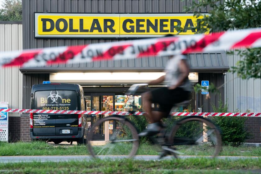 JACKSONVILLE, FLORIDA - AUGUST 27: A bicyclist rides past the Dollar General store where three people were shot and killed the day before on August 27, 2023 in Jacksonville, Florida. Police say that the attack by a gunman on Black customers at the store is being investigated as a hate crime. (Photo by Sean Rayford/Getty Images)