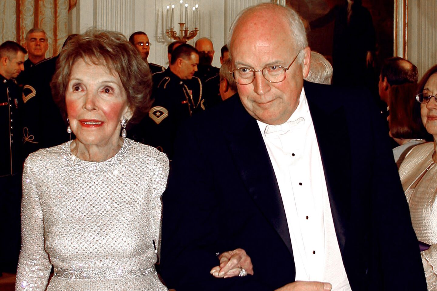 Vice President Dick Cheney escorts the former first lady at a white-tie dinner for Britain's Queen Elizabeth II at the White House in May 2007.