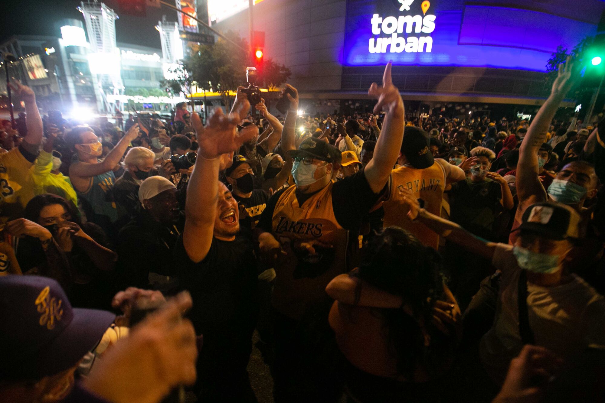 Fans gather near Staples Center to celebrate after the Lakers' win over the Miami Heat in the NBA Finals.