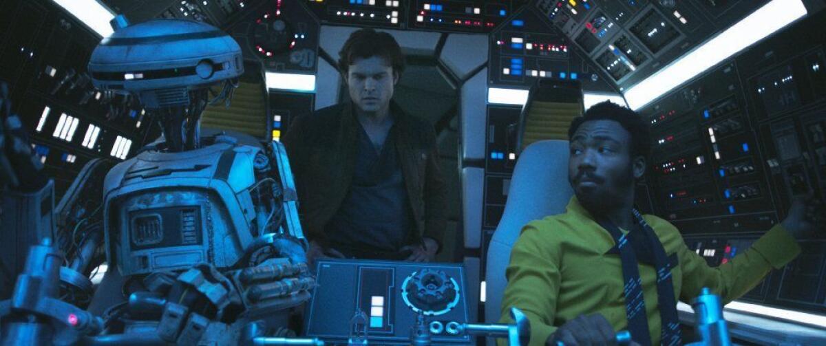 Phoebe Waller-Bridge as L3-37, from left, Alden Ehrenreich as Han Solo and Donald Glover as Lando Calrissian and in "Solo: A Star Wars Story."