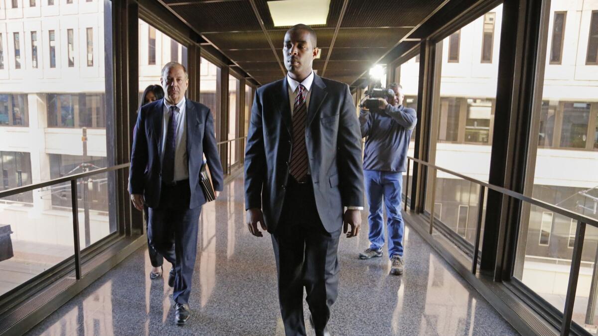 Former Minneapolis FBI agent Terry James Albury, front, and his attorney, Joshua Dratel, walk out of the Federal Courthouse in St. Paul, Minn., on Thursday.