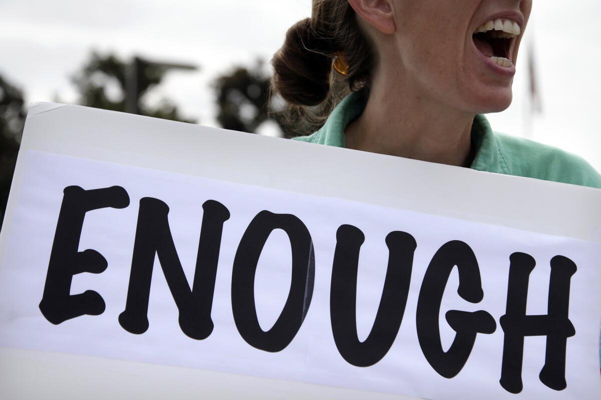 Vicki Maturo, of Culver City, protests against the government shutdown outside the federal building in Los Angeles.