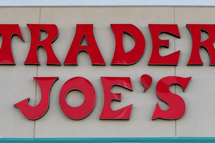 PINECREST, FL - OCTOBER 18: The Trader Joe's sign is seen during the grand opening of a Trader Joe's on October 18, 2013 in Pinecrest, Florida. Trader Joe's opened its first store in South Florida where shoppers can now take advantage of the California grocery chains low-cost wines and unique items not found in other stores. About 80 percent of what they sell is under the Trader Joe's private label. (Photo by Joe Raedle/Getty Images) ORG XMIT: 185464740