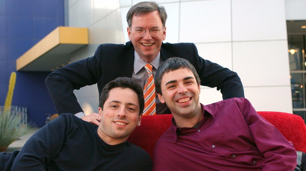 Eric Schmidt, top, and Alphabet co-founders Sergey Brin, left, and Larry Page at the company's headquarters in 2004.