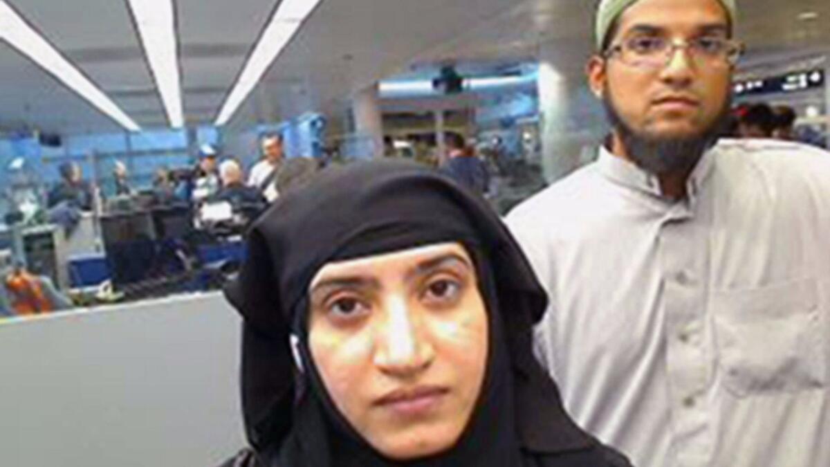 Tashfeen Malik and her husband, Syed Rizwan Farook, at O'Hare International Airport in Chicago in July 2014.