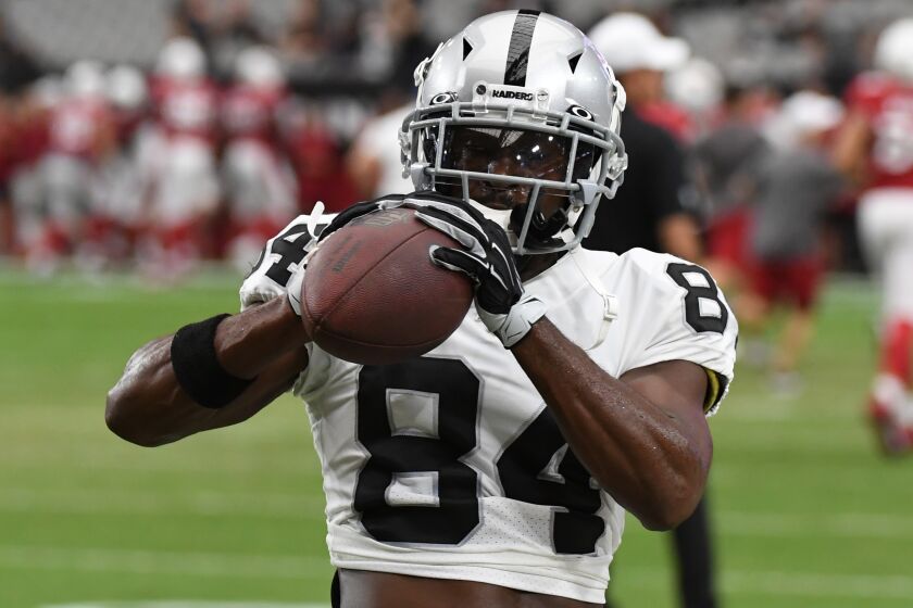 GLENDALE, ARIZONA - AUGUST 15: Antonio Brown #84 of the Oakland Raiders warms up prior to an NFL preseason game against the Arizona Cardinals at State Farm Stadium on August 15, 2019 in Glendale, Arizona. (Photo by Norm Hall/Getty Images)