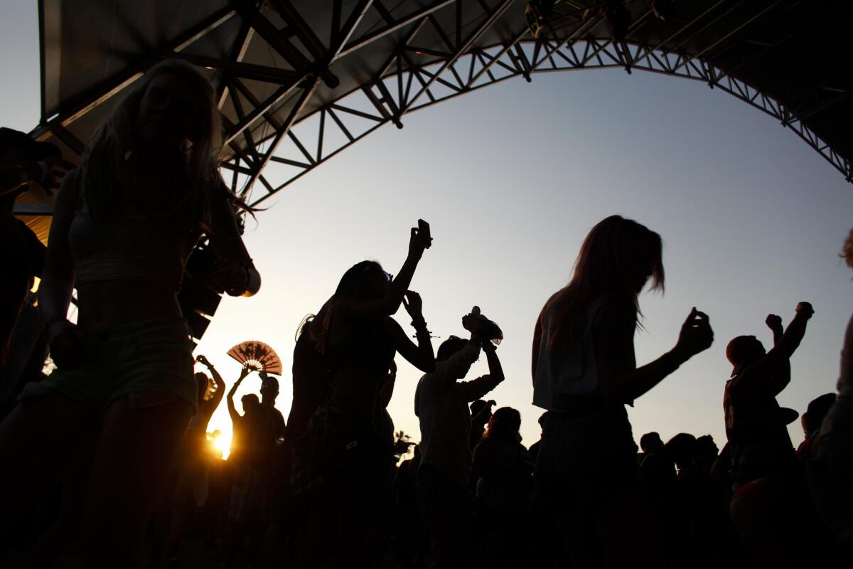 Dancers take in DJ Dillon Francis as the sun sets during the second weekend of the Coachella Valley Music and Arts Festival in Indio.