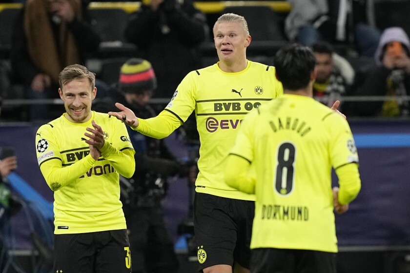 Dortmund's Erling Haaland, center celebrates after scoring his side's fourth goal during the Champions League Group C soccer match between Borussia Dortmund and Besiktas Istanbul in Dortmund, Germany, Tuesday, Dec. 7, 2021. (AP Photo/Martin Meissner)