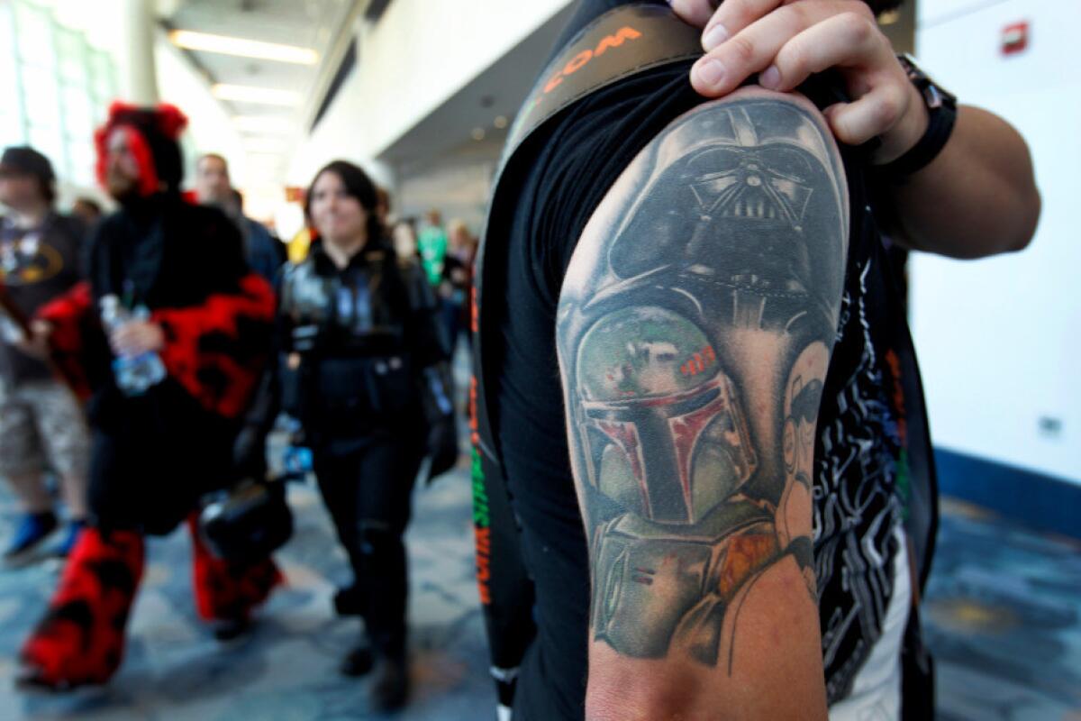 Jon Aragon of Rancho Cucamonga uncovers his "Star Wars" tattoos at Star Wars Celebration.
