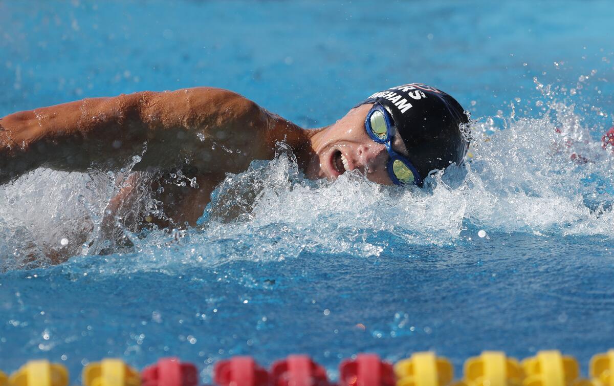 Huntington Beach swimmer Caden Cunningham swims in the boys' 100-yard freestyle at last year's Wave League finals. 